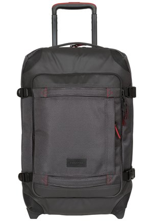Black wheeled backpack with a textured exterior, red accents, multiple straps, and a front zip pocket. Sturdy handle and base for stability.