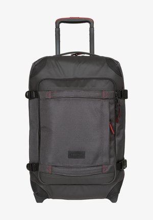 Black wheeled backpack with a textured exterior, red accents, multiple straps, and a front zip pocket. Sturdy handle and base for stability.