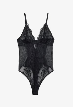 Mustast pitsist bodysuit läbipaistvate võrkküljedega, reguleeritavate õlapaeltega ja lillemustriga üle kogu pinna, sügava V-kaelusega disainiga.