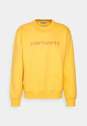 Lyse gul sweatshirt med lange ærmer, der har orange "carhartt" logo broderet på tværs af brystet samt ribbet rund halsudskæring og manchetter.