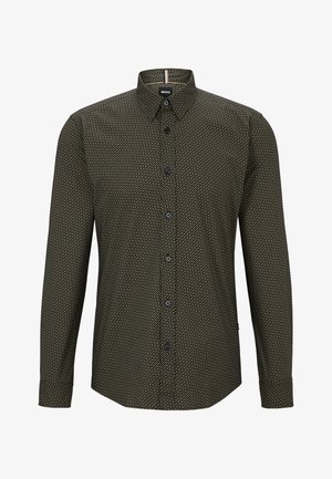 Camicia con bottoni in verde scuro con motivo geometrico. Presenta un colletto a punta, maniche lunghe e bottoni neri. Tessuto dalla consistenza morbida.