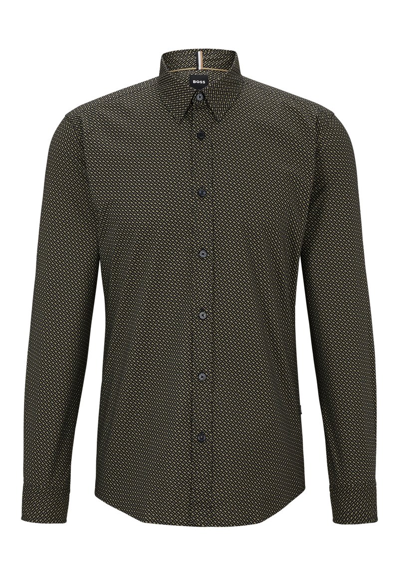 Camicia con bottoni in verde scuro con motivo geometrico. Presenta un colletto a punta, maniche lunghe e bottoni neri. Tessuto dalla consistenza morbida.