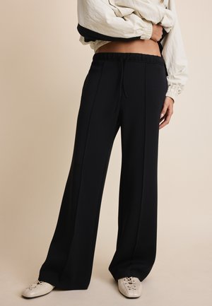 Stradivarius, SOFT-TOUCH WIDE-LEG TROUSERS WITH SEAM DETAIL 04512257 - Pantalon de survêtement - black