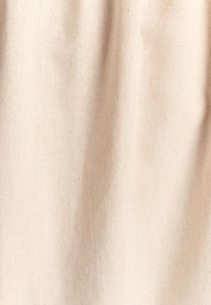 Beige cotton fabric with a textured weave, featuring a soft, slightly rough surface and subtle variations in tone throughout.