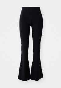 Fekete, trapéz szabású leggings magas derékkal, sima, rugalmas anyagból készült. A lábak fokozatosan szélesednek a térdtől a szegélyig.