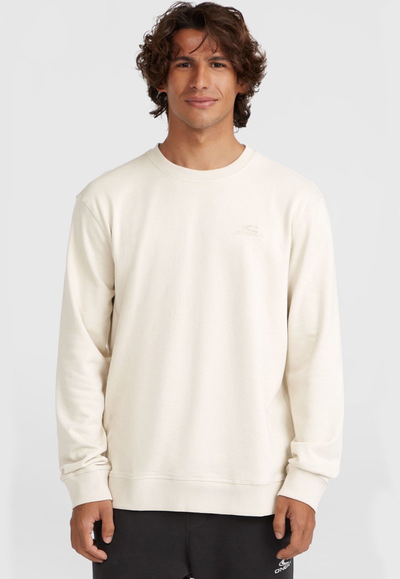 Crème lange mouwen sweatshirt met een ronde hals en ribgebreide manchetten, met een subtiele logo in lichte borduursel op de borst.