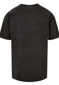 Black short-sleeved T-shirt made of denim fabric. Features a round neckline and visible stitching along the sleeves and hem. Simple design.