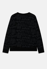 Felpa nera con un design grafico ripetuto delle parole "Air Jordan" in diverse dimensioni e stili, tessuto testurizzato e polsini a coste.