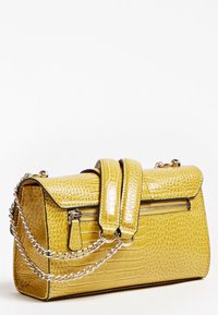 Yellow textured leather handbag with gold chain strap, top handle, and zipper pocket on the side against a white background.