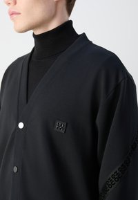 HUGO DEQUILOS - Zip-up sweatshirt - black