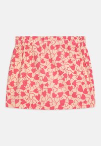 Elastisk midjeskjørt laget av mykt stoff, med en lys beige bakgrunn og spredte rosa hjerte-mønstre gjennom hele.