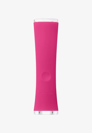 Pink silicone beauty device with a smooth, tapered design, transparent top, and raised button; features a logo embossed on the surface.