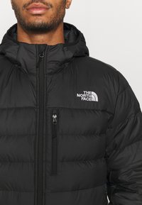 The North Face ACONCAGUA HOODIE - Casaco de penas - black