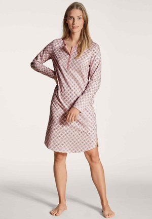 Camicione a maniche lunghe di colore rosa con un motivo geometrico. Presenta una chiusura a bottoni e spacco laterale, realizzato in un tessuto morbido e leggero.