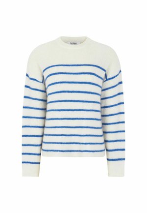 Kreemist värvi kudumispleegiga sinised horisontaalsed triibud. Omab ümmargust kaelust ja pikki varrukaid, millel on pehme ja tekstuuriline välimus.