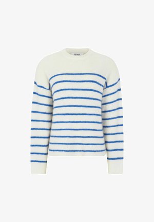 Kreemist värvi kudumispleegiga sinised horisontaalsed triibud. Omab ümmargust kaelust ja pikki varrukaid, millel on pehme ja tekstuuriline välimus.