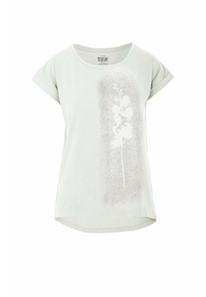 T-shirt verde chiaro a maniche corte in morbido cotone con stampa floreale bianca e dettaglio di texture sottile sul lato sinistro. Collo rotondo.