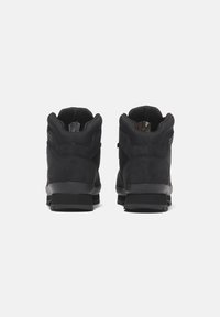 Black ankle boots with a suede and textile upper, rubber sole, padded collar, and reinforced heel for support and durability.
