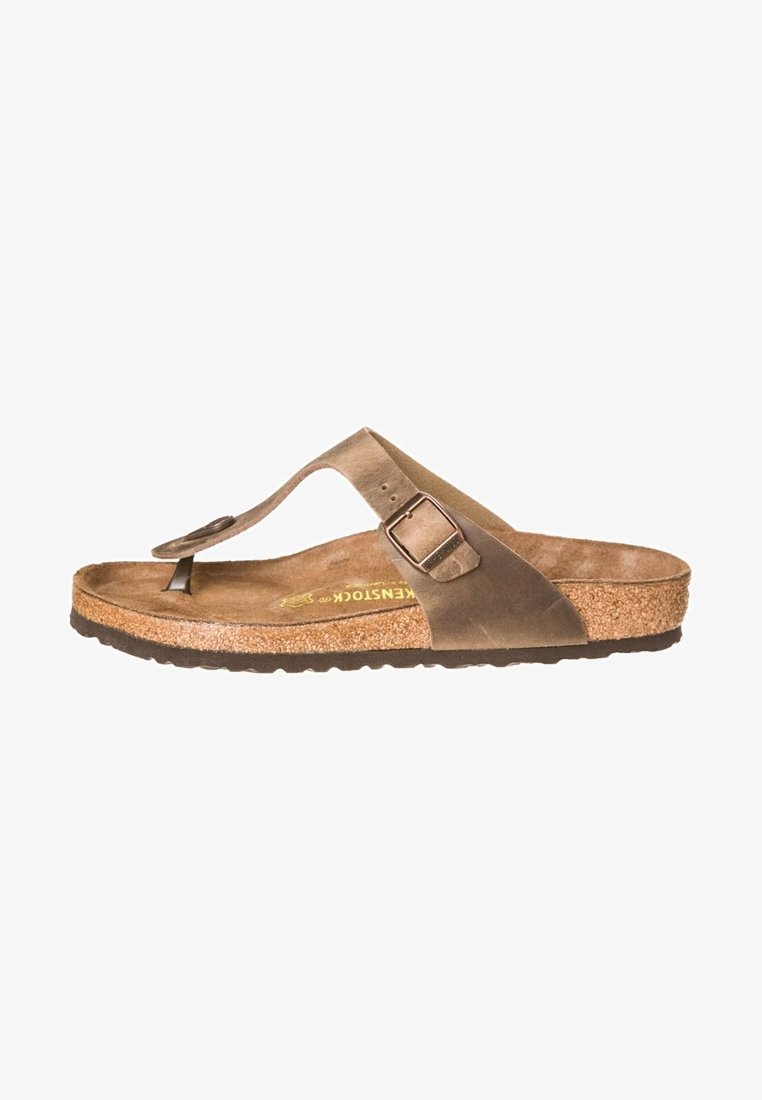 Brune læder flip-flop sandal med en bred rem og spænde detalje. Kork fodseng med struktureret gummisål for greb.