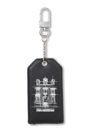 Black rectangular keychain with silver clasp and chain, featuring a white architectural sketch of a building and "KARL LAGERFELD" text below.