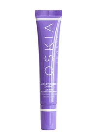 Tube souple violet avec un bouchon blanc, présentant le logo "OSKIA LONDON" et des détails du produit en texte blanc. Traitement anti-imperfections pour l'éclat.
