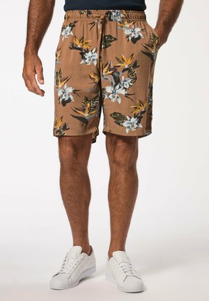 Pantalones cortos marrones con un cinturón ajustable en la cintura, decorados con flores blancas y amarillas y hojas verdes. Tejido suave con bolsillos laterales.