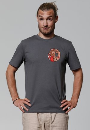 Grijze katoenen t-shirt met een ronde afbeelding van kleurrijke cartoonfiguren. Korte mouwen en een standaard ronde hals.