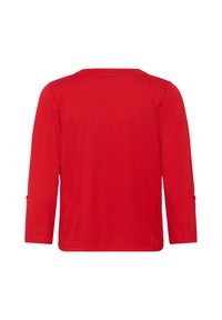 Chemise rouge à manches longues vue de dos avec un col simple et des pattes de boutonnage sur les manches.