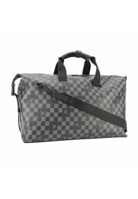Sac de sport en motif écossais gris foncé, fabriqué à partir d'un matériau texturé. Il possède des poignées doubles et une bandoulière réglable.