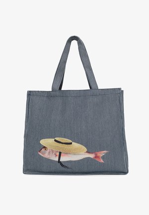 Striped blue and white tote bag with handles, featuring a printed fish wearing a straw hat with a black chin strap.