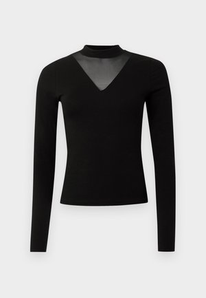 Black long-sleeve top with a mock neck and sheer V-shaped mesh insert at the chest. Soft fabric with a fitted silhouette.