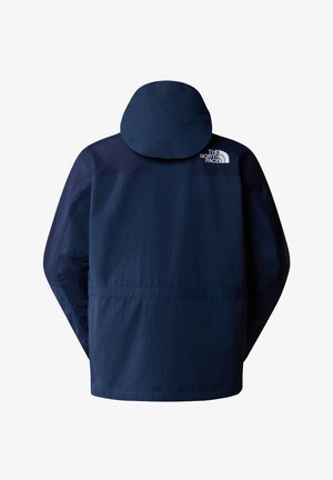 Marineblauwe waterdichte jas met capuchon, voorzien van een ritssluiting aan de voorkant, elastische manchetten en het logo op de bovenrug in het wit.