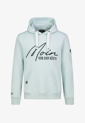 Light blue hoodie with drawstrings, front pocket, and black printed text "Moin von der Küste." Features ribbed cuffs and logo patch on sleeve.