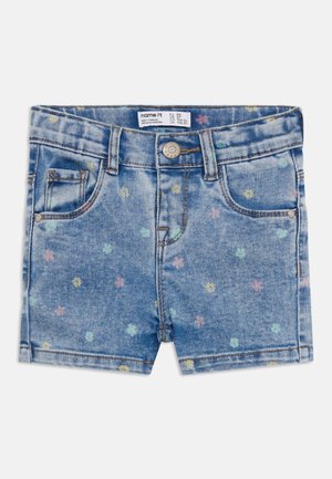 Denim blue toddler shorts with small pastel floral prints, button closure, and front and coin pockets.