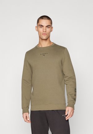 Olive green sweatshirt with long sleeves, crew neckline, and black printed logo "HYROX" on the chest and sleeve. Smooth cotton blend material.