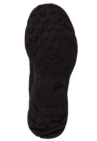 Czarna gumowa podeszwa sportowa z teksturowanym, wielokierunkowym wzorem przyczepności. Posiada logo Adidas z boku. Wzmocnione krawędzie.