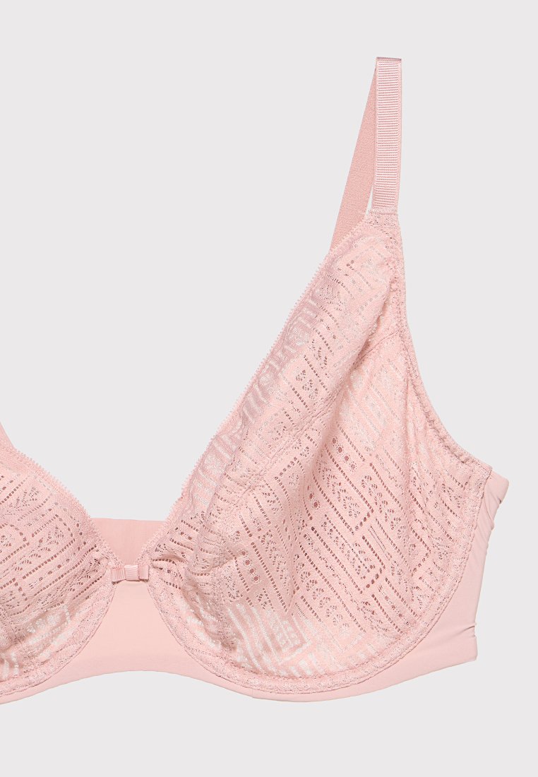 Różowy biustonosz z koronkowymi miseczkami o geometrycznych wzorach, wykonany z miękkiego materiału, z regulowanymi ramiączkami i gładkim pasem pod biustem dla wsparcia.