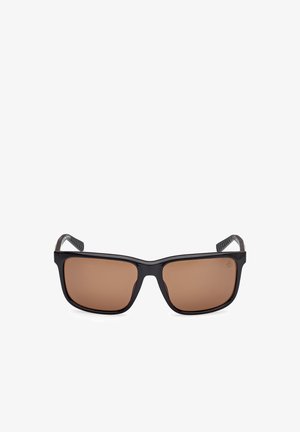Black sunglasses with rectangular brown lenses, textured arms, and a sturdy, matte finish. Features curved, flexible tips for comfort.