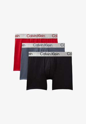 Boxer-briefs pour hommes Calvin Klein en rouge, gris et noir ; tissu doux, design taille mi-haute, ceinture élastique avec logo de la marque.