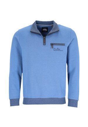 Light blue textured pullover with quarter zipper, dark blue collar, cuffs, hem, and a zippered chest pocket with logo embroidery.