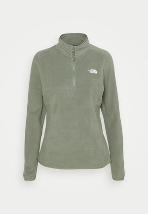 Oliwkowo zielony polarowy pulower z długimi rękawami, półzamkiem z przodu, stójką oraz białym logo The North Face na lewej piersi.