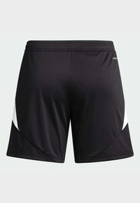 Short de sport noir avec des panneaux latéraux blancs inclinés et une ceinture élastique, montré de dos sur un fond clair uni.