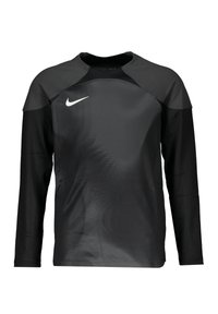 Haut de sport à manches longues noir de Nike, avec une texture lisse, un col rond et des accents de design subtils à l'avant.