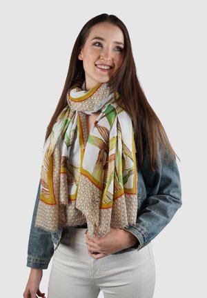 Kleurige sjaal gemaakt van lichtgewicht stof, met een botanische print in groen en bruin, omrand door een geometrisch patroon.