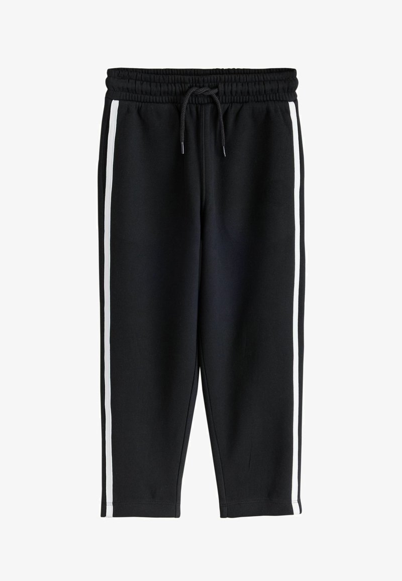 Pantalon de survêtement noir avec taille élastique, cordon de serrage et bandes blanches courant le long des côtés extérieurs des jambes.