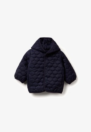 Marineblauwe gewatteerde jas met een capuchon, voorzien van grote ronde patronen, een drukknoopsluiting en contrasterende afwerking langs de randen.