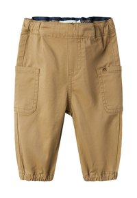 Bež cargo hlače z elastičnim pasom, dvema sprednjima žepoma in elastičnimi manšetami. Narejene so iz trpežnega, teksturiranega materiala.