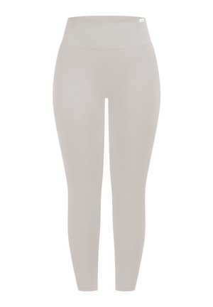 Lichtbeige, hooggetailleerde legging gemaakt van rekbare stof. Gladde textuur, nauwsluitend design en enkellengte met een brede tailleband.