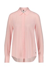 Button-up shirt in light pink with white vertical stripes, long sleeves, classic collar, featuring a curved hem and logo accent at the bottom.