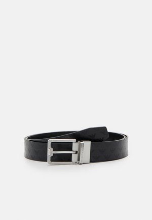 Black leather belt with a textured pattern and a silver metal buckle. The buckle features a sleek, rectangular design.